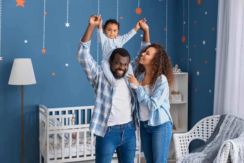 Photo of a happy family playing in their home
